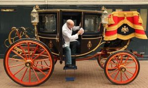 If it looks like rain on the big day then the Glass Coach built in 1881 and seen here at the Royal Mews in London will be used.JPG
